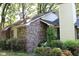 Side view of a cozy brick house with manicured bushes in the yard at 20 Anderson Ave, Charleston, SC 29412