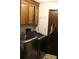 Laundry room with cabinets and newer stainless-steel washing machine and dryer at 20 Anderson Ave, Charleston, SC 29412