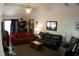 Comfortable living room featuring plush sofas, a ceiling fan, and natural lighting at 20 Anderson Ave, Charleston, SC 29412