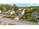 Aerial view of home in residential neighborhood, showcasing mature trees and well-maintained yards at 2007 Robin Wood Blvd, Moncks Corner, SC 29461