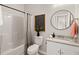 Well-lit bathroom featuring a tub and shower combination and modern accents at 202 Resinwood Rd, Moncks Corner, SC 29461