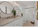 Bathroom with a double sink vanity, granite countertops, and modern fixtures at 202 Resinwood Rd, Moncks Corner, SC 29461
