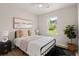 Cozy bedroom features a comfortable bed, soft colors, and natural light from the window at 202 Resinwood Rd, Moncks Corner, SC 29461