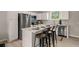 Well-appointed kitchen with stainless steel appliances, granite countertops, and a cozy breakfast bar at 202 Resinwood Rd, Moncks Corner, SC 29461