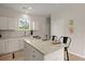 Well-lit kitchen featuring granite countertops, stainless steel appliances, and bar seating at 202 Resinwood Rd, Moncks Corner, SC 29461