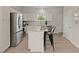 Bright kitchen with stainless steel appliances, granite countertops, and a convenient center island at 202 Resinwood Rd, Moncks Corner, SC 29461