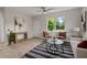 Cozy living room with a large window, stylish furnishings, and an eye-catching rug at 202 Resinwood Rd, Moncks Corner, SC 29461