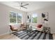 Bright living room with large windows, contemporary decor, and stylish seating arrangements at 202 Resinwood Rd, Moncks Corner, SC 29461
