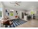 Bright open-concept living room and kitchen featuring stainless steel appliances and modern finishes at 202 Resinwood Rd, Moncks Corner, SC 29461
