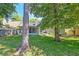 Backyard with a screened porch and mature trees at 208 Evesham Dr, Summerville, SC 29485