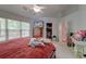 Cozy bedroom featuring a ceiling fan, natural light, and a spacious closet at 208 Evesham Dr, Summerville, SC 29485
