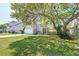 Charming single-Gathering home featuring a well-maintained lawn, mature shade trees, and an attached garage at 208 Evesham Dr, Summerville, SC 29485