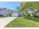 Charming one-story home with a two-car garage and well-maintained front yard at 208 Evesham Dr, Summerville, SC 29485