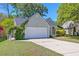 Charming one-story home with a two-car garage and well-maintained front yard at 208 Evesham Dr, Summerville, SC 29485