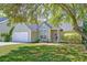 Charming single-story home featuring a well-manicured lawn and attached two car garage at 208 Evesham Dr, Summerville, SC 29485