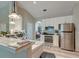 Well-equipped kitchen featuring stainless steel appliances, white cabinets, and a breakfast bar at 208 Evesham Dr, Summerville, SC 29485