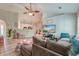 Inviting living room showcasing an open floor plan with views into the modern kitchen and dining area at 208 Evesham Dr, Summerville, SC 29485