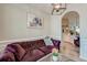 Elegant living room with plush sofa, decorative lighting, and an open view of the kitchen at 208 Evesham Dr, Summerville, SC 29485