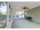 Screened porch with ceiling fan and wicker bench at 208 Evesham Dr, Summerville, SC 29485