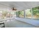 Enclosed sun room with large windows providing ample natural light and views of the backyard at 208 Evesham Dr, Summerville, SC 29485
