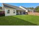 A spacious backyard with a screened porch, lush lawn, and privacy fence at 218 Wexford Ct, Summerville, SC 29483
