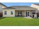 A spacious backyard with a screened porch, lush lawn, and privacy fence at 218 Wexford Ct, Summerville, SC 29483