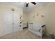 Bright bedroom features a crib, dinosaur decor, ceiling fan, and neutral carpet and paint at 218 Wexford Ct, Summerville, SC 29483