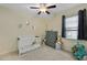 Cozy, -friendly bedroom featuring a crib, soft carpet, and cheerful dinosaur themed decor at 218 Wexford Ct, Summerville, SC 29483