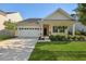 Charming single-story home with a well-maintained lawn and attached two-car garage at 218 Wexford Ct, Summerville, SC 29483