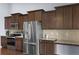 Modern kitchen featuring stainless steel appliances and dark wood cabinets at 218 Wexford Ct, Summerville, SC 29483