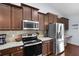 Well-equipped kitchen with stainless steel appliances, granite countertops, and ample cabinet space at 218 Wexford Ct, Summerville, SC 29483