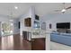 Contemporary kitchen with stainless steel dishwasher, granite countertops, and adjacent living space at 218 Wexford Ct, Summerville, SC 29483