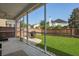 Covered screened porch featuring a stone patio, well-maintained lawn, and backyard view at 218 Wexford Ct, Summerville, SC 29483
