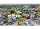 Expansive aerial view showcases a residential neighborhood with diverse architectural styles and lush greenery at 22 Sheppard St, Charleston, SC 29403