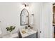 Stylish bathroom with marble countertop, modern fixtures, and a decorative mirror at 22 Sheppard St, Charleston, SC 29403