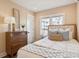 Inviting bedroom with soft bedding, wooden dresser, and plenty of natural light at 22 Sheppard St, Charleston, SC 29403