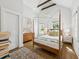 Vaulted ceiling bedroom features a four-poster bed, with beautiful wood floors, and plenty of natural light at 22 Sheppard St, Charleston, SC 29403