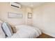 Tranquil bedroom with a plush bed, soft pillows, and minimalist wall decor at 22 Sheppard St, Charleston, SC 29403