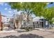 Street view of a charming home with mature trees, attractive curb appeal, and a gated entrance at 22 Sheppard St, Charleston, SC 29403