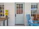 Charming exterior shot featuring a quaint dutch door flanked by windows and greenery at 22 Sheppard St, Charleston, SC 29403