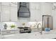 Bright kitchen with modern appliances, marble counters, and shiplap walls at 22 Sheppard St, Charleston, SC 29403