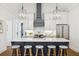 Kitchen featuring marble countertops, stainless steel appliances, and a modern range hood at 22 Sheppard St, Charleston, SC 29403