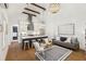 A gorgeous kitchen with white cabinets, stainless appliances and a large central island at 22 Sheppard St, Charleston, SC 29403