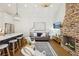 A combined living and kitchen area featuring a brick fireplace and marble countertops at 22 Sheppard St, Charleston, SC 29403
