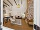 Open floor plan featuring living room, kitchen and exposed brick fireplace at 22 Sheppard St, Charleston, SC 29403