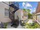 Cozy outdoor patio with spiral staircase, outdoor seating, and lush greenery for relaxing at 22 Sheppard St, Charleston, SC 29403