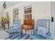 Relaxing porch with rocking chairs and accent pillows create a cozy outdoor seating area at 22 Sheppard St, Charleston, SC 29403