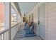 Charming porch with rocking chairs, and decor, perfect for relaxing or entertaining guests at 22 Sheppard St, Charleston, SC 29403