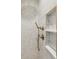 Elegant shower featuring bronze fixtures, detailed shower tile, and a white marble built-in shelf at 22 Sheppard St, Charleston, SC 29403
