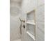 Beautiful shower featuring marble tile and gold fixtures at 22 Sheppard St, Charleston, SC 29403